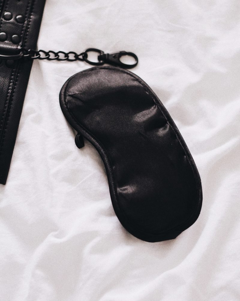 Image of black silk blindfold for blog on affordable ways to spice up your sex life