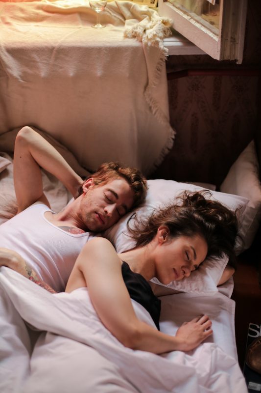 couple in bed - blog on being too tired for sex - Fave Real