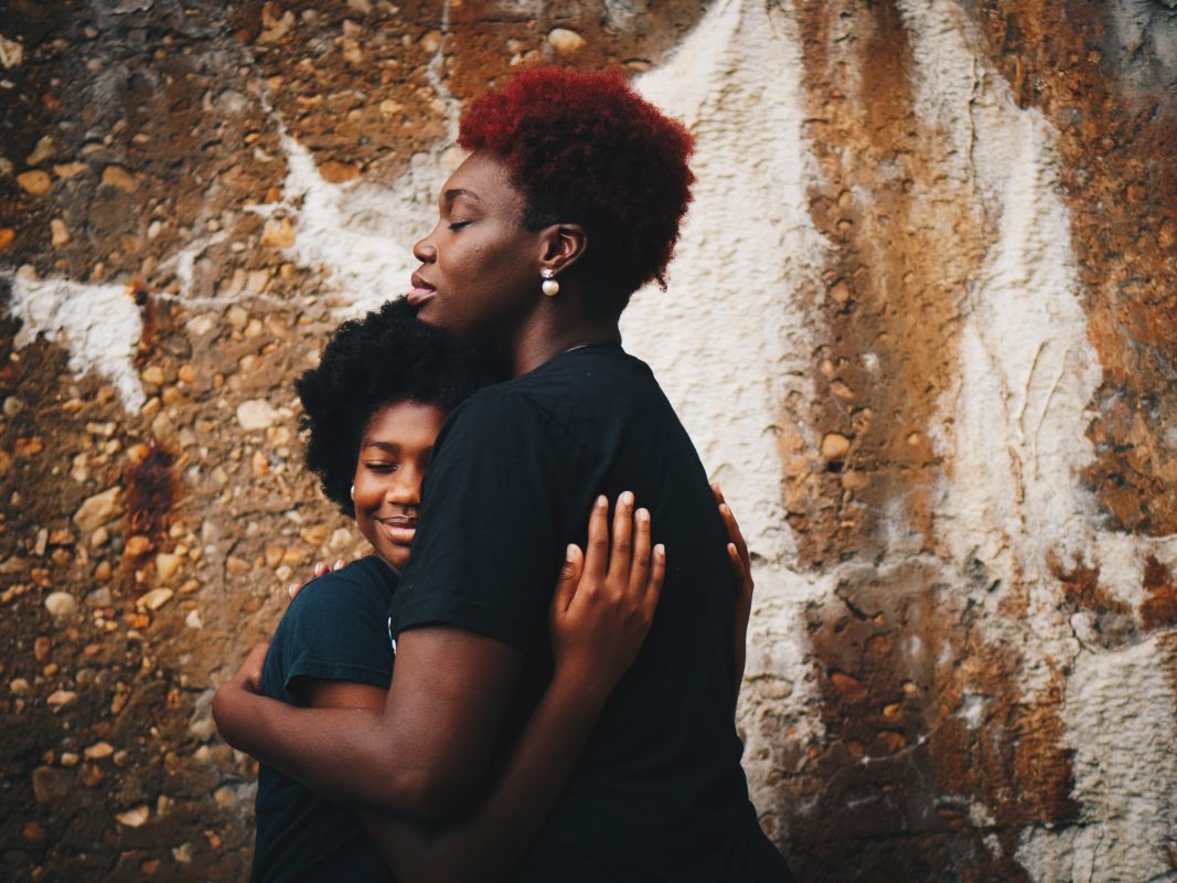 Image of black couple cuddling - pregnancy - The Fave Real